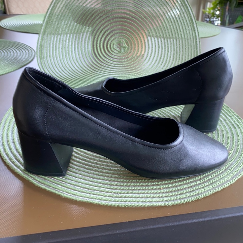 Black leather pumps.